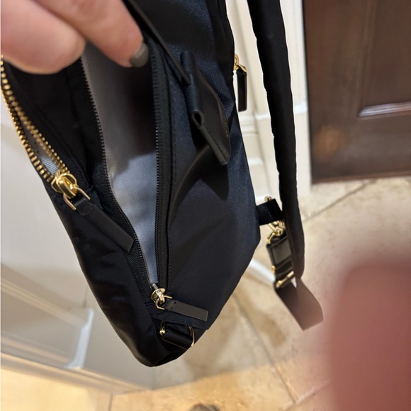 TUMI crossbody sling travel bag Great condition Black gold trim no odors/ tears - Picture 11 of 13